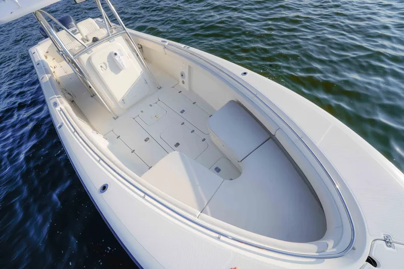 Slide: The Image of 2005 Pursuit 3480 Center Console boat on water, showcasing spacious deck and seating. - 35