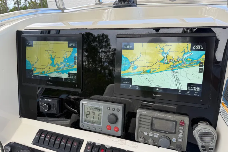 Slide: The Image of 2005 Pursuit 3480 Center Console with Garmin navigation displays and marine electronics. - 44