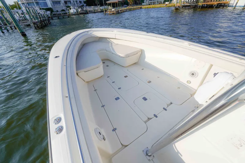 Slide: The Image of 2005 Pursuit 3480 Center Console boat interior with spacious deck and seating. - 31