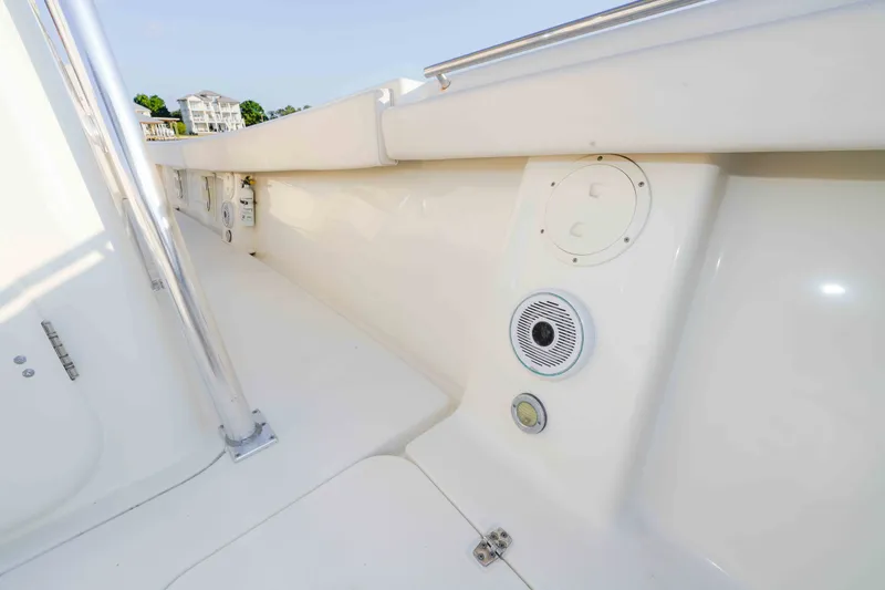 Slide: The Image of 2005 Pursuit 3480 Center Console boat deck with speaker and railing. - 40