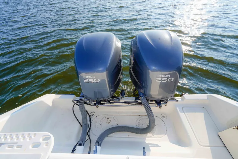 Slide: The Image of 2005 Pursuit 3480 Center Console with twin Yamaha 250 engines on water. - 20