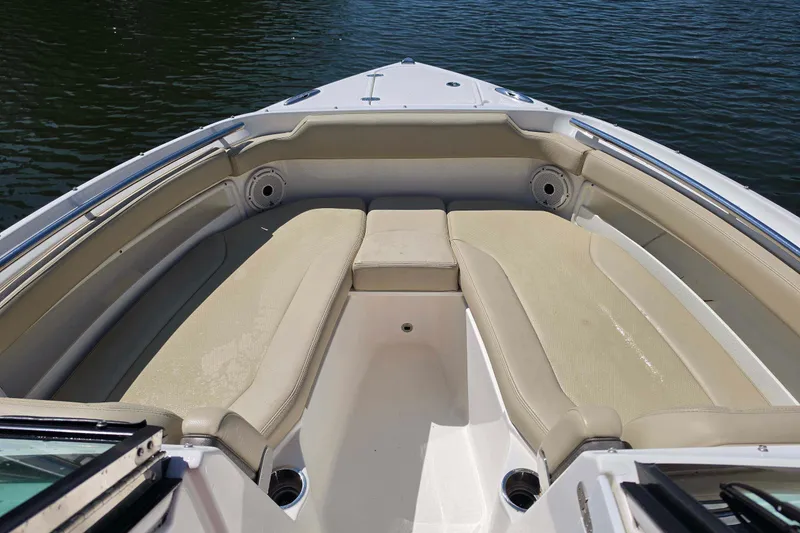 Slide: The Image of 2021 Pursuit DC 266 Dual Console boat with spacious seating and water view. - 21