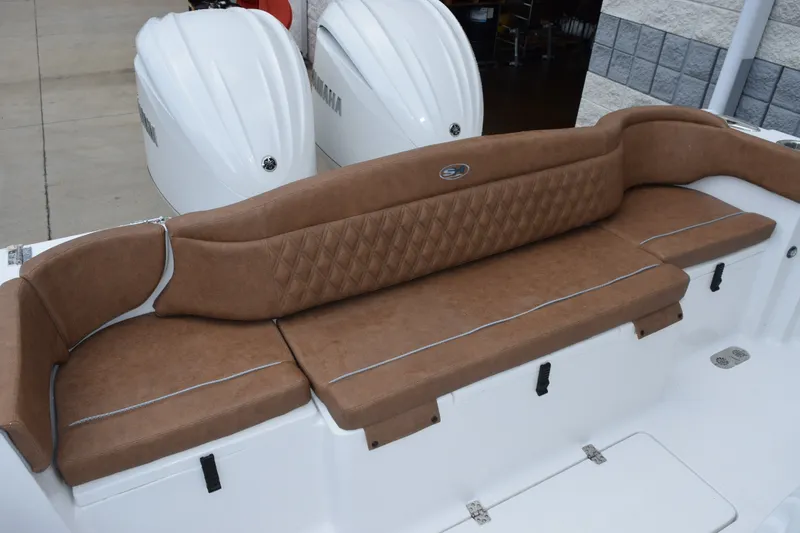 Slide: The Image of Luxurious seating on 2027 Sea Hunt Ultra 285SE boat with dual Yamaha engines. - 9