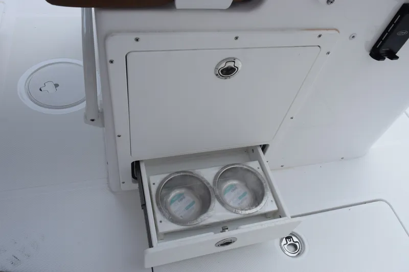 Slide: The Image of Storage compartment with pull-out drawer on 2027 Sea Hunt Ultra 285SE boat. - 18