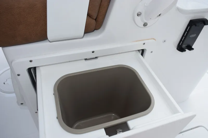 Slide: The Image of Storage compartment on 2027 Sea Hunt Ultra 285SE boat, featuring a built-in container. - 19