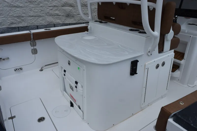 Slide: The Image of 2027 Sea Hunt Ultra 285SE boat interior with seating and storage compartments. - 7