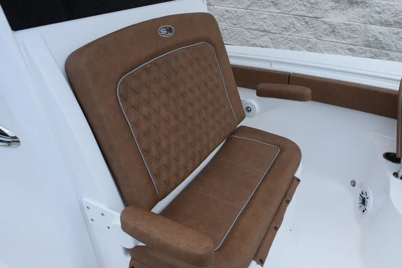 Slide: The Image of Brown leather seating on 2027 Sea Hunt Ultra 285SE boat, featuring diamond stitching. - 14