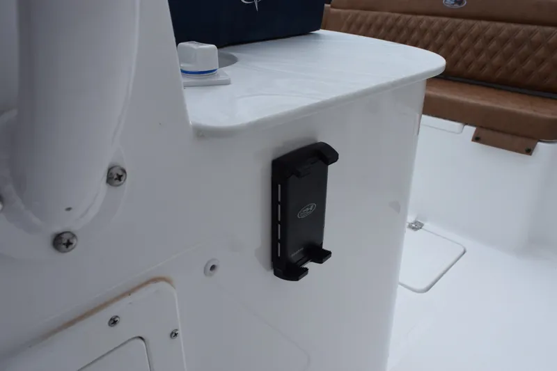 Slide: The Image of 2027 Sea Hunt Ultra 285SE boat interior with seating and mounted device holder. - 20