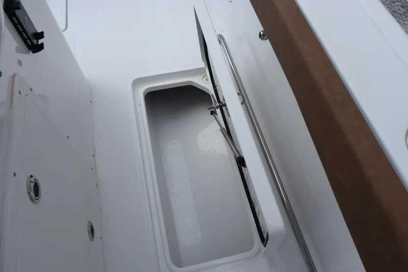 Slide: The Image of Storage compartment on 2027 Sea Hunt Ultra 285SE boat, featuring sleek design and durable materials. - 21