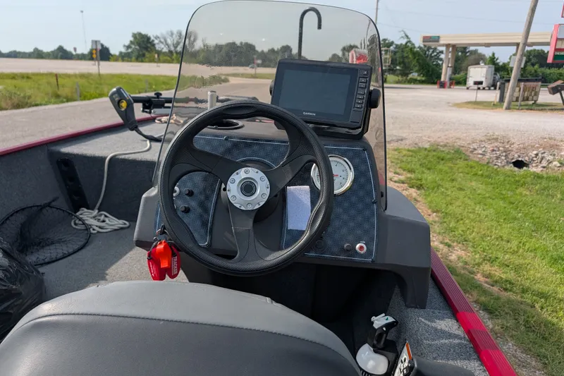 Slide: The Image of 2021 Tracker Bass Tracker Classic XL boat dashboard with steering wheel and navigation system. - 63