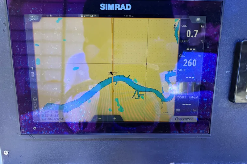 Slide: The Image of Simrad navigation display on 2007 Regulator 26 Classic boat, showing map and data. - 27