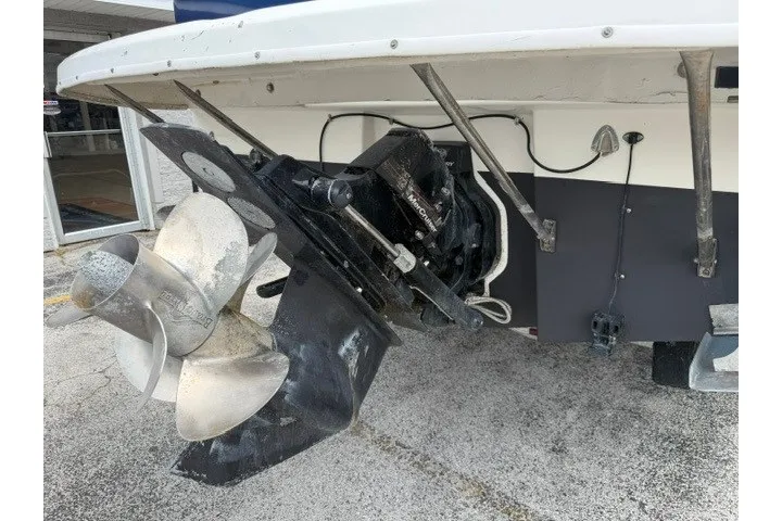 Slide: The Image of 2007 Bayliner Discovery 246 boat stern with propeller and outdrive detail. - 18