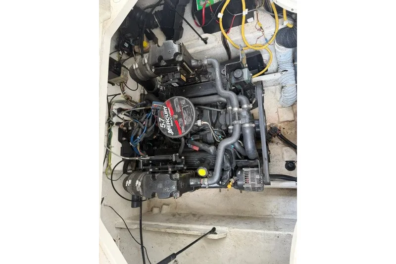 Slide: The Image of Engine compartment of a 2007 Bayliner Discovery 246 boat, featuring a Mercury 5.7L engine. - 15