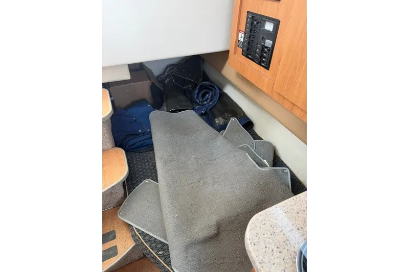 Slide: The Image of Interior of 2007 Bayliner Discovery 246 with carpet and control panel. - 8