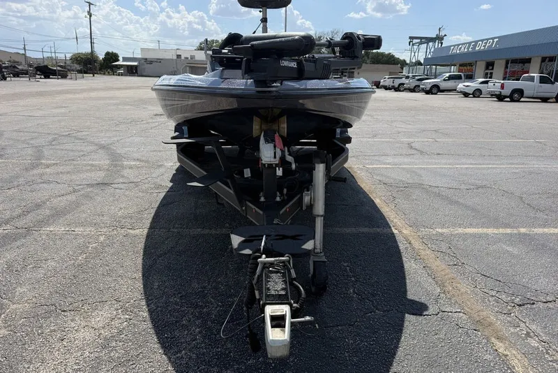 Slide: The Image of 2018 Skeeter FX21 boat on trailer in parking lot, sunny day. - 4