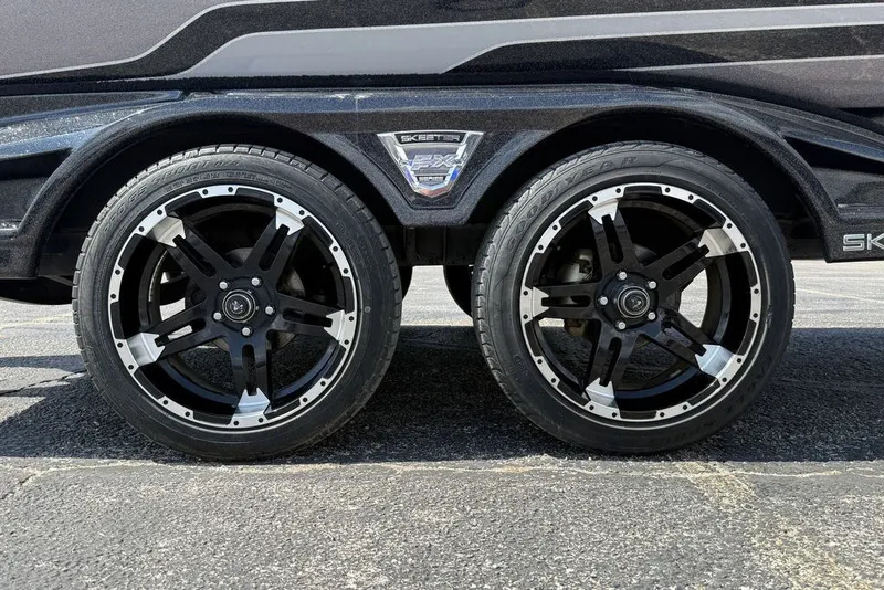 Slide: The Image of 2018 Skeeter FX21 trailer with stylish black and silver wheels. - 2