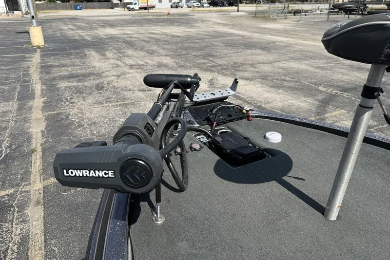 Slide: The Image of 2018 Skeeter FX21 boat with Lowrance equipment on deck in a parking lot. - 20
