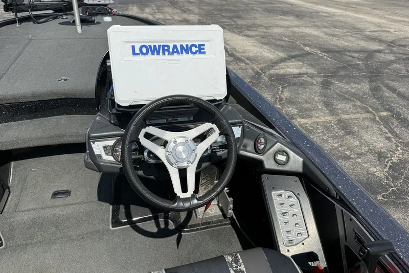Slide: The Image of 2018 Skeeter FX21 boat dashboard with Lowrance navigation system and steering wheel. - 8