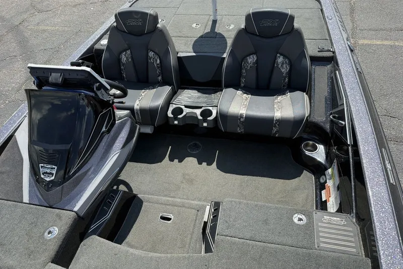 Slide: The Image of 2018 Skeeter FX21 boat interior with dual seats and steering console. - 14