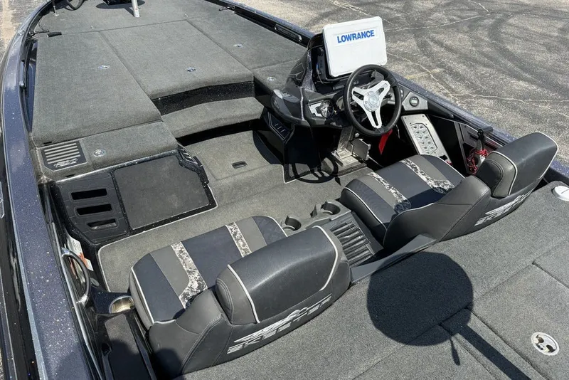 Slide: The Image of 2018 Skeeter FX21 boat interior with steering wheel and Lowrance display. - 12