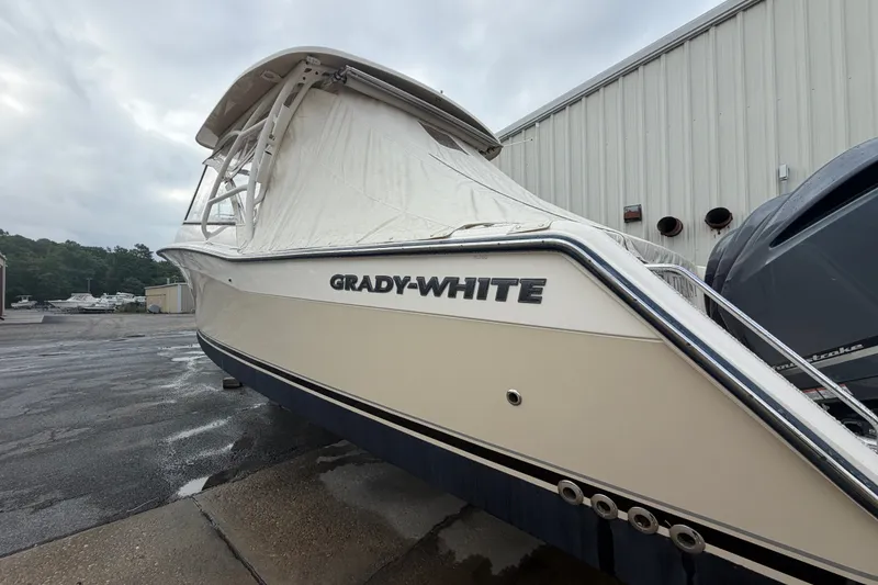 Slide: The Image of 2017 Grady-White Freedom 335 boat in storage, covered and parked outdoors. - 4