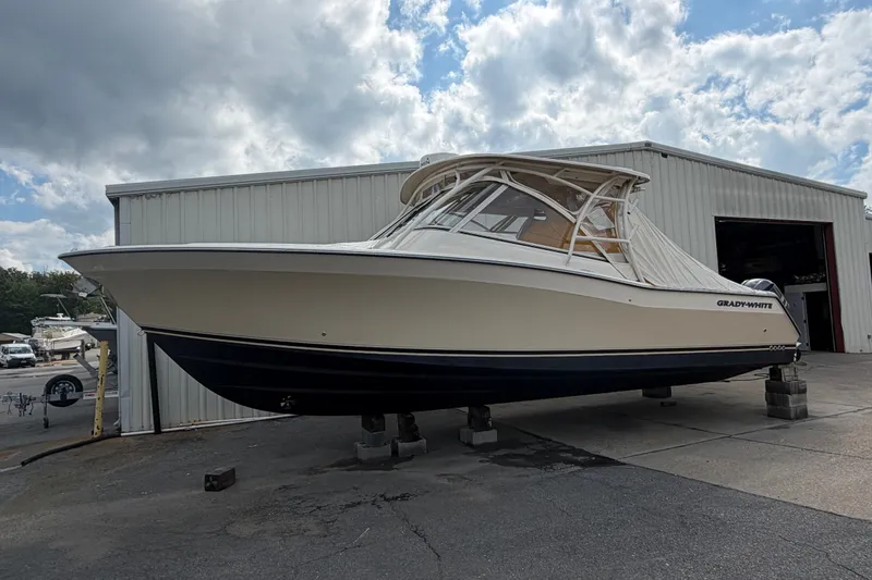 Slide: The Image of 2017 Grady-White Freedom 335 boat on blocks outside a storage facility. - 1