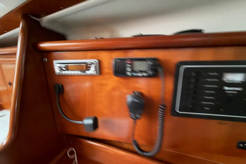 Slide: The Image of Interior view of a 2001 Beneteau 331 sailboat with communication equipment. - 17