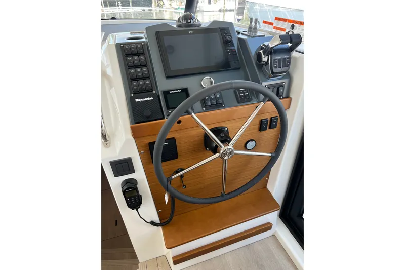 Slide: The Image of Helm of 2026 Beneteau Swift Trawler 41 Fly with advanced navigation controls. - 22