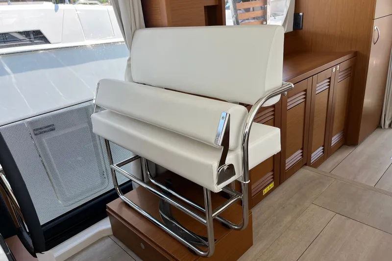 Slide: The Image of Interior of 2026 Beneteau Swift Trawler 41 Fly with modern seating and wooden cabinetry. - 20