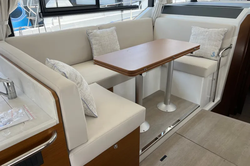 Slide: The Image of Interior of 2026 Beneteau Swift Trawler 41 Fly with cozy seating and table. - 19