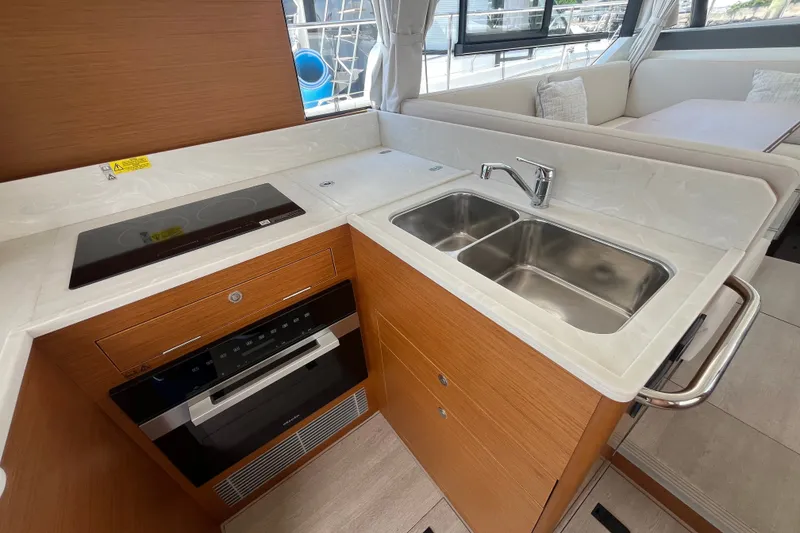 Slide: The Image of Modern kitchen in 2026 Beneteau Swift Trawler 41 Fly with dual sink and stove. - 16