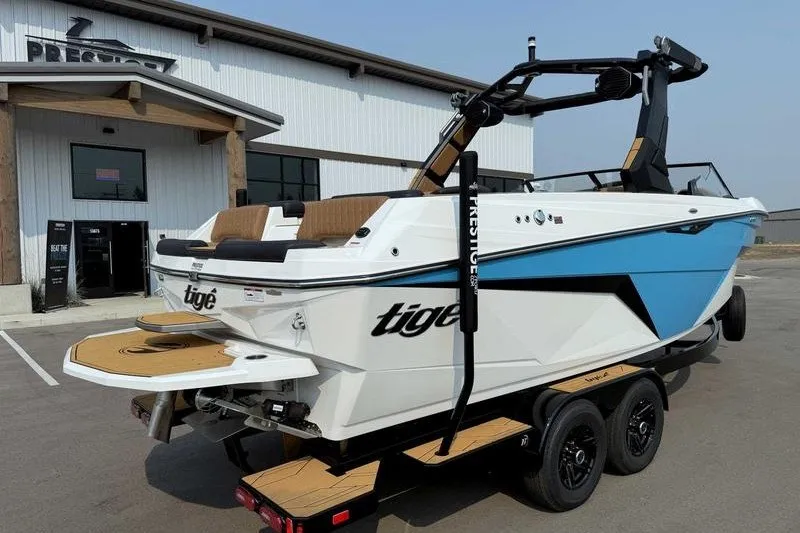 Slide: The Image of 2027 Tigé Z3 boat on trailer outside dealership, showcasing sleek design and modern features. - 4