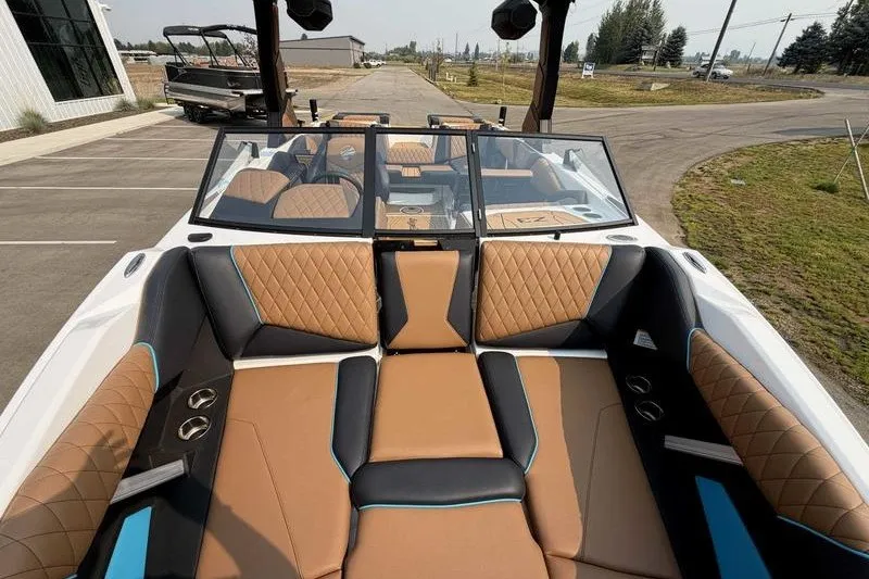 Slide: The Image of 2027 Tigé Z3 boat interior with luxurious tan and black seating. - 20