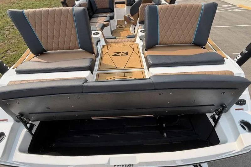 Slide: The Image of 2027 Tigé Z3 boat interior with luxurious seating and storage compartment. - 19