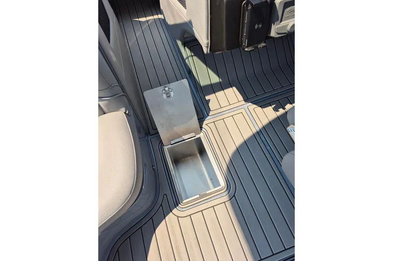 Slide: The Image of 2027 MB B52-23 Classic LIMITED interior with open storage compartment on sleek floor. - 12