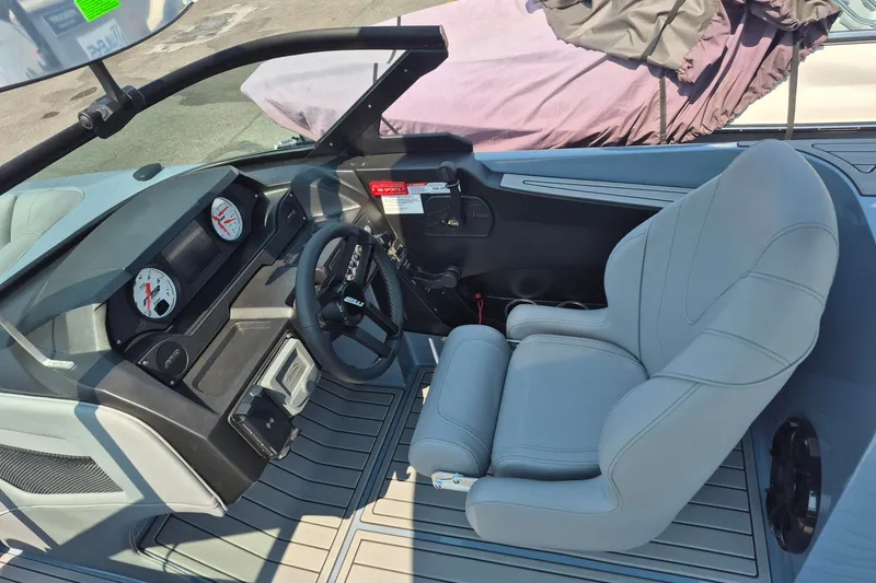 Slide: The Image of 2027 MB B52-23 Classic LIMITED boat interior with sleek dashboard and comfortable seating. - 5