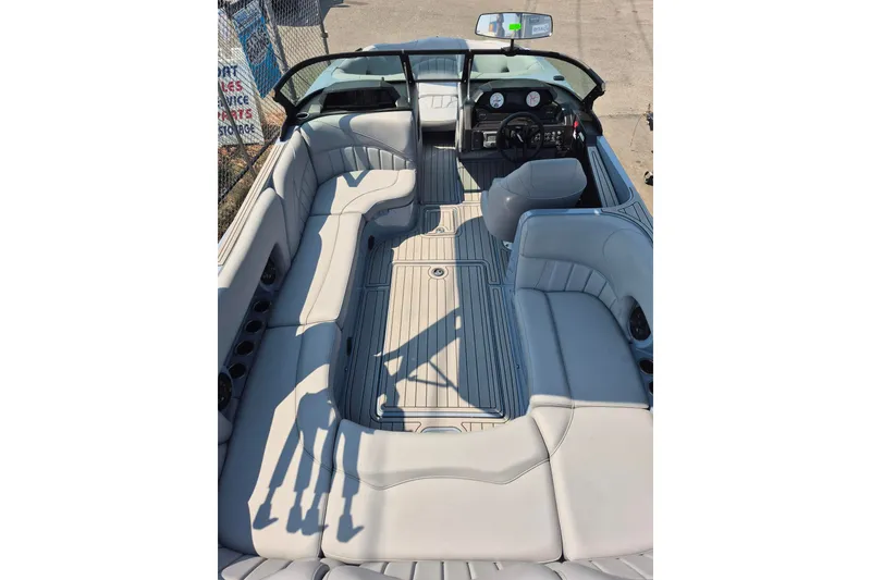 Slide: The Image of 2027 MB B52-23 Classic LIMITED boat interior with luxurious seating and modern dashboard. - 9