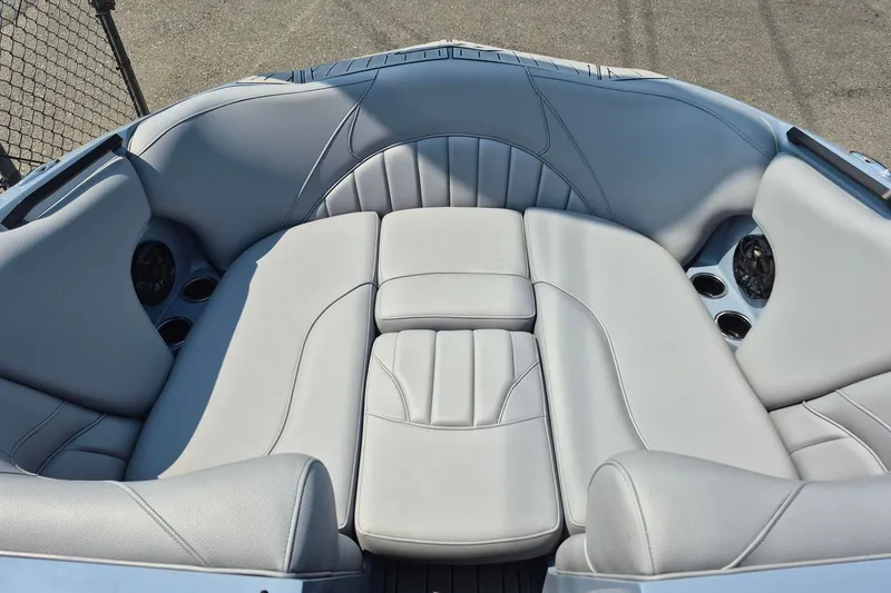Slide: The Image of Luxurious seating in the 2027 MB B52-23 Classic LIMITED boat, featuring sleek gray upholstery. - 6
