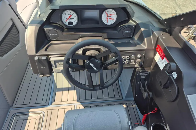 Slide: The Image of Interior view of 2027 MB B52-23 Classic LIMITED boat dashboard and steering wheel. - 4