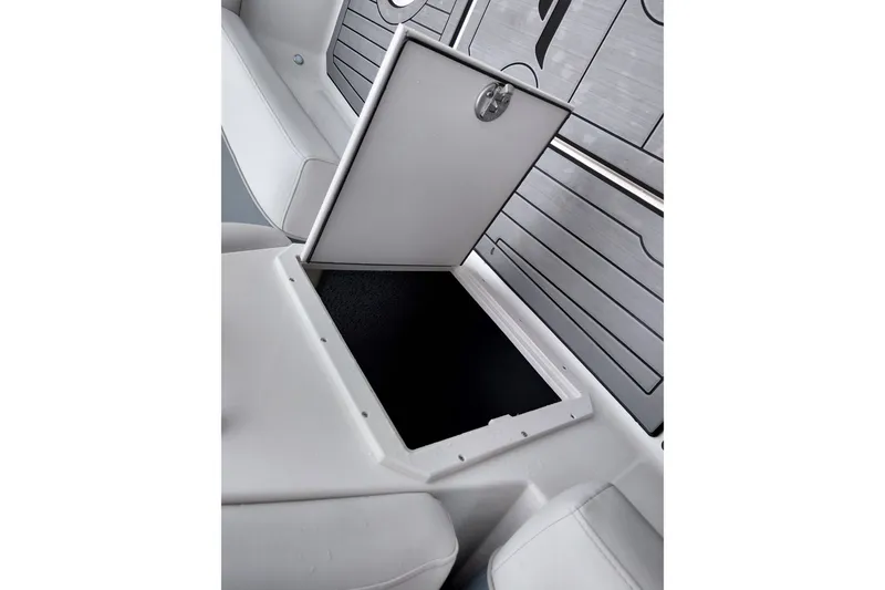 Slide: The Image of Storage compartment in 2027 Starcraft SVX 211 OB boat, featuring sleek white interior design. - 29