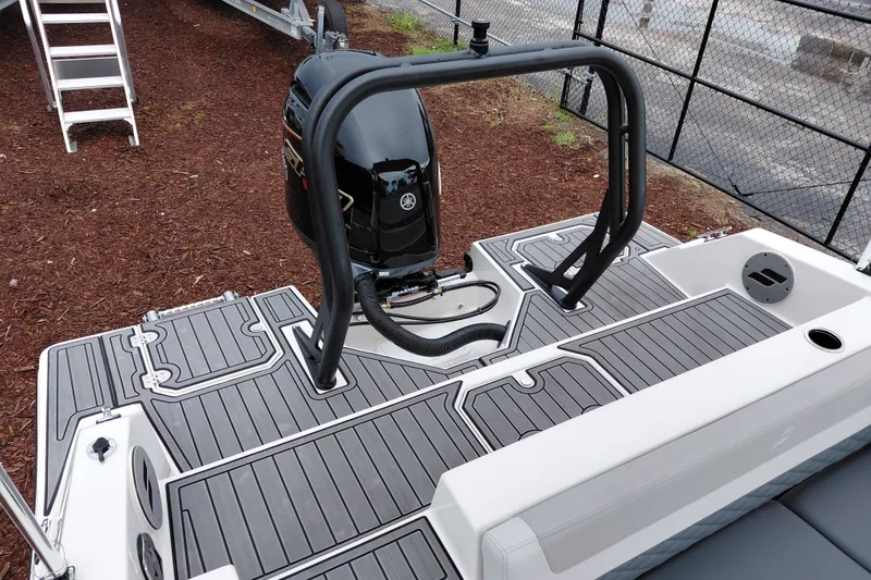 Slide: The Image of 2027 Starcraft SVX 211 OB boat with sleek deck design and powerful outboard motor. - 24