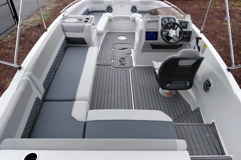 Slide: The Image of 2027 Starcraft SVX 211 OB boat interior with sleek seating and modern dashboard design. - 22