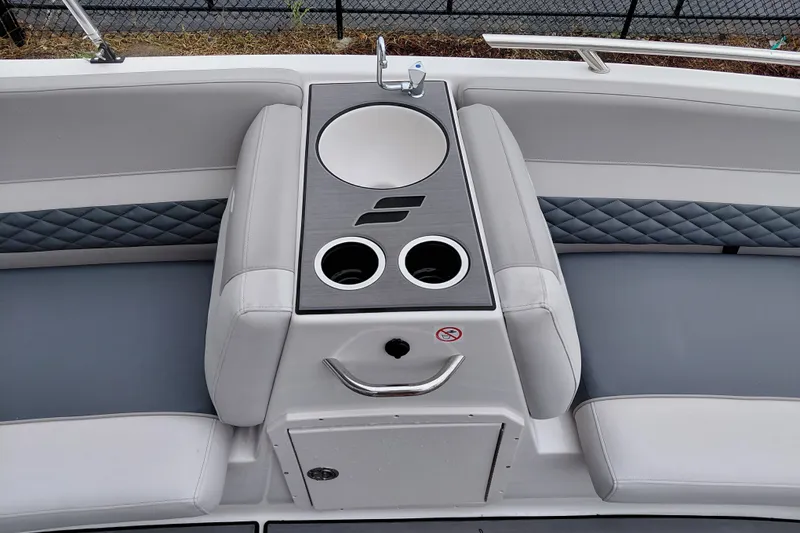 Slide: The Image of 2027 Starcraft SVX 211 OB boat interior with seating, cup holders, and sink. - 28