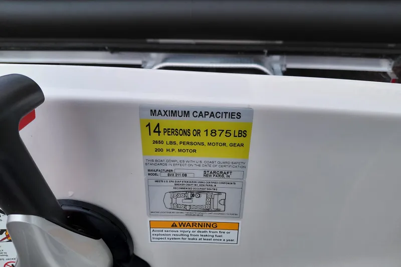Slide: The Image of Starcraft SVX 211 OB 2027 boat capacity label, 14 persons or 1875 lbs, 200 HP motor. - 17