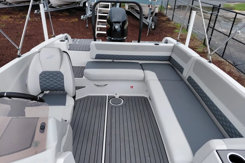 Slide: The Image of 2027 Starcraft SVX 211 OB boat interior with gray seating and modern design. - 20