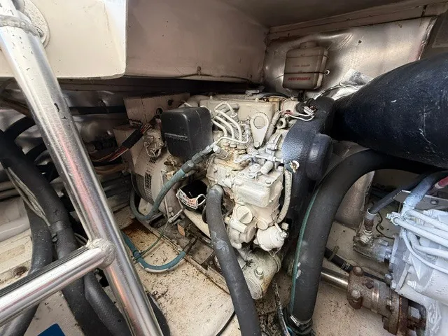 Slide: The Image of Engine room of a 1997 Ocean Yachts 40ss with visible cables and hoses. - 17