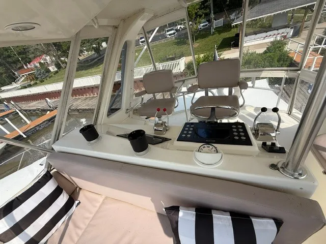 Slide: The Image of The image shows the cockpit of a 1997 Ocean Yachts 40ss with a helm console and seating. - 8