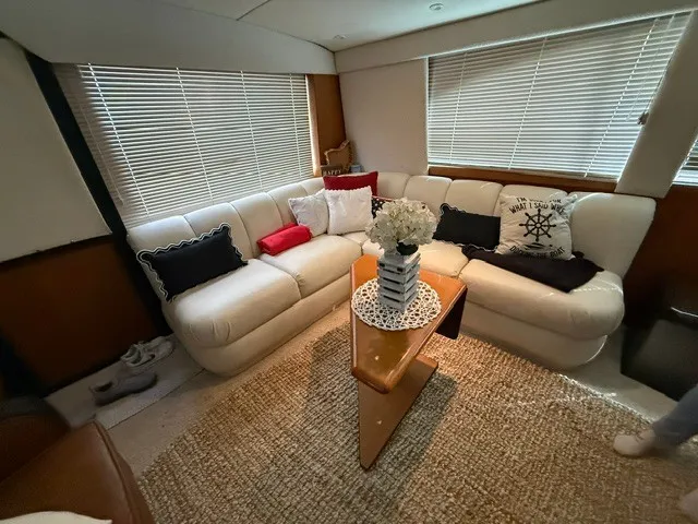 Slide: The Image of The image shows the interior of a 1997 Ocean Yachts 40ss with a cozy seating area. - 9