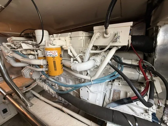 Slide: The Image of Engine room of the 1997 Ocean Yachts 40ss with visible cables and pipes. - 21