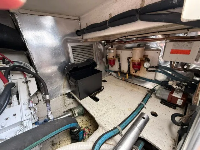 Slide: The Image of Engine room of a 1997 Ocean Yachts 40ss with hoses and filters. - 18